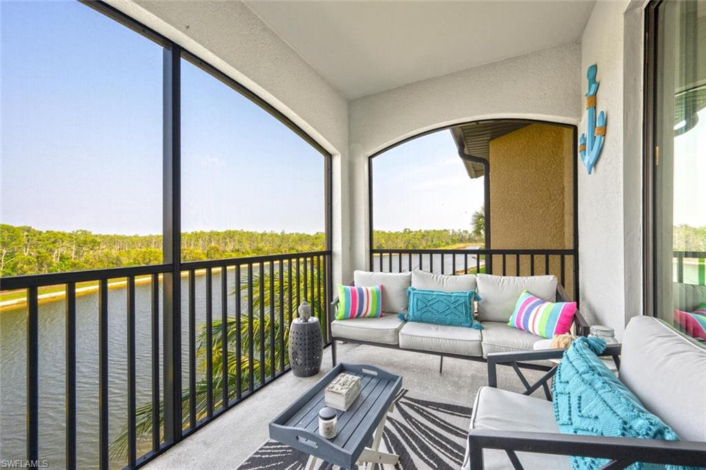 9572 Trevi Court, Unit 5045 Naples, FL 34113 - Photo 20 of 30 a balcony with couch and city view