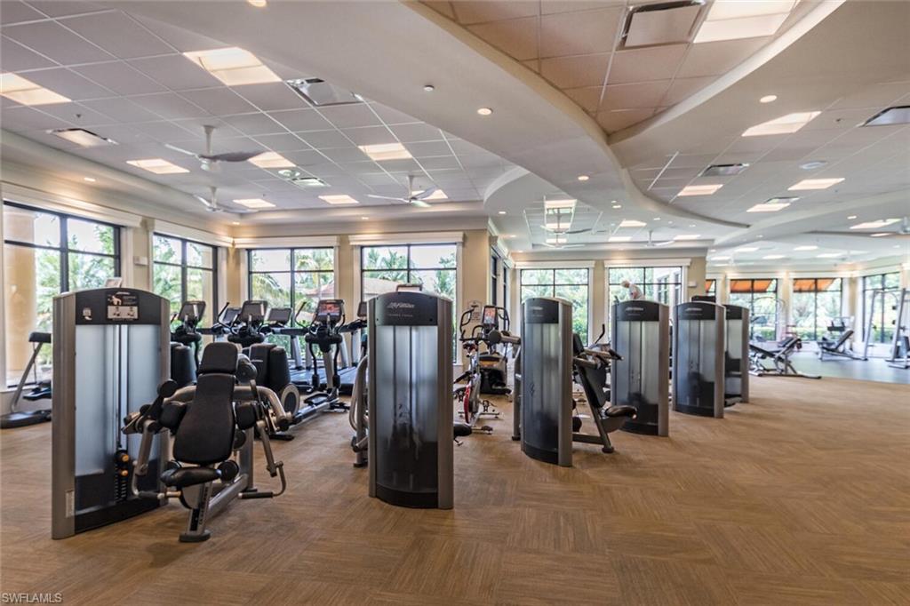 9572 Trevi Court, Unit 5045 Naples, FL 34113 - Photo 29 of 30 a view of a room with gym equipment