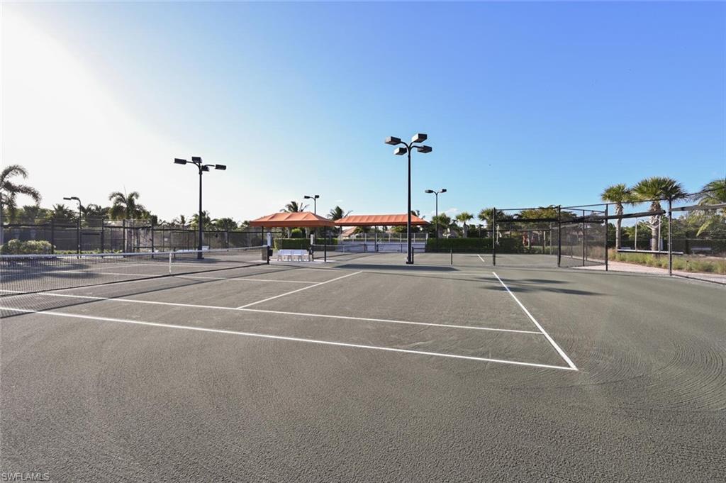 9572 Trevi Court, Unit 5045 Naples, FL 34113 - Photo 30 of 30 a view of a tennis court