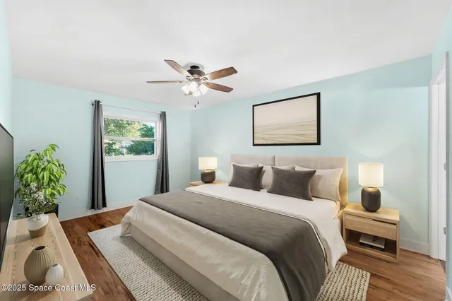 a bedroom with bed and a window