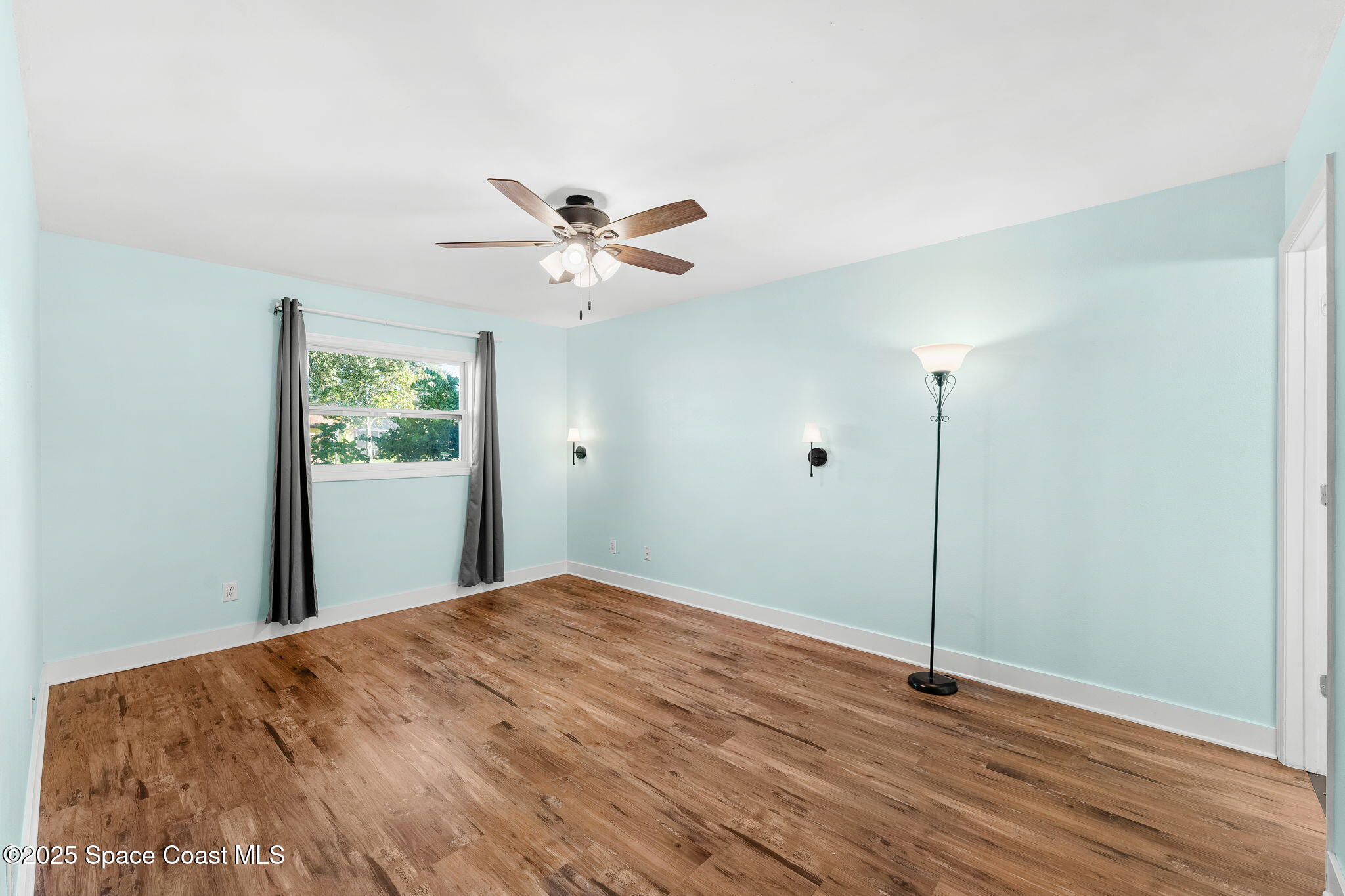 955 Sabal Grove Drive Rockledge, FL 32955 - Photo 15 of 39 a view of an empty room with a window