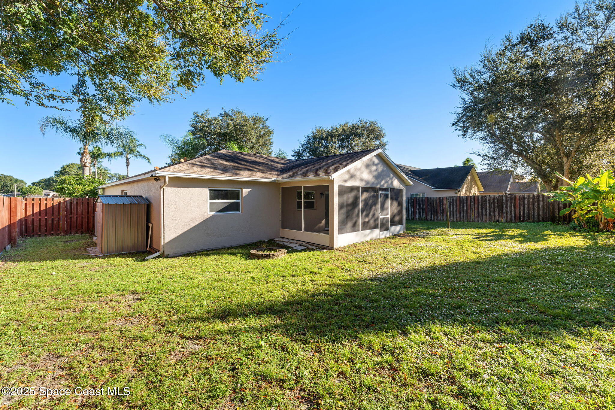955 Sabal Grove Drive Rockledge, FL 32955 - Photo 26 of 39 a view of a house with a big yard