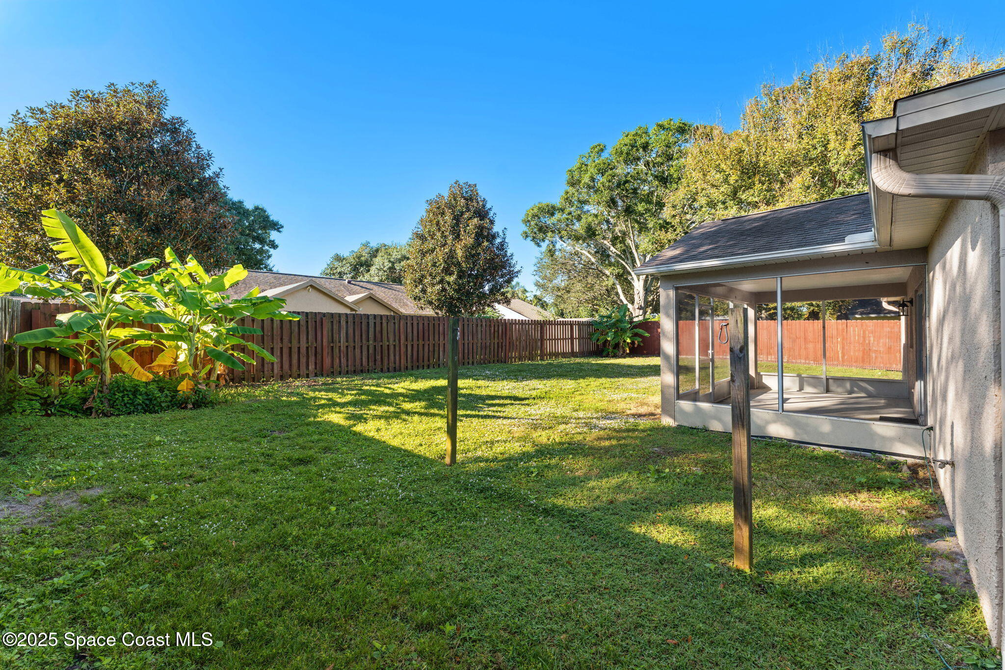 955 Sabal Grove Drive Rockledge, FL 32955 - Photo 28 of 39 a swimming pool with lots of tress in front of it