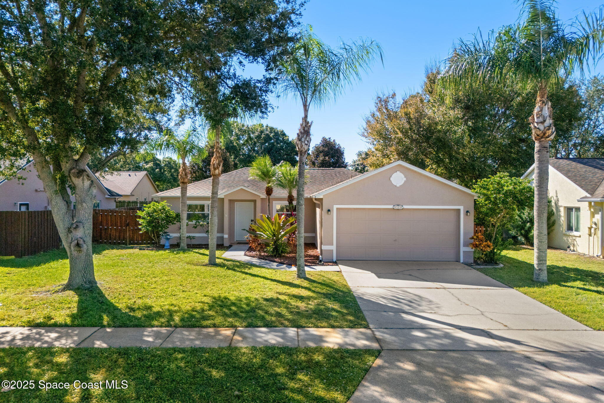 955 Sabal Grove Drive Rockledge, FL 32955 - Photo 30 of 39 a front view of house with yard and trees