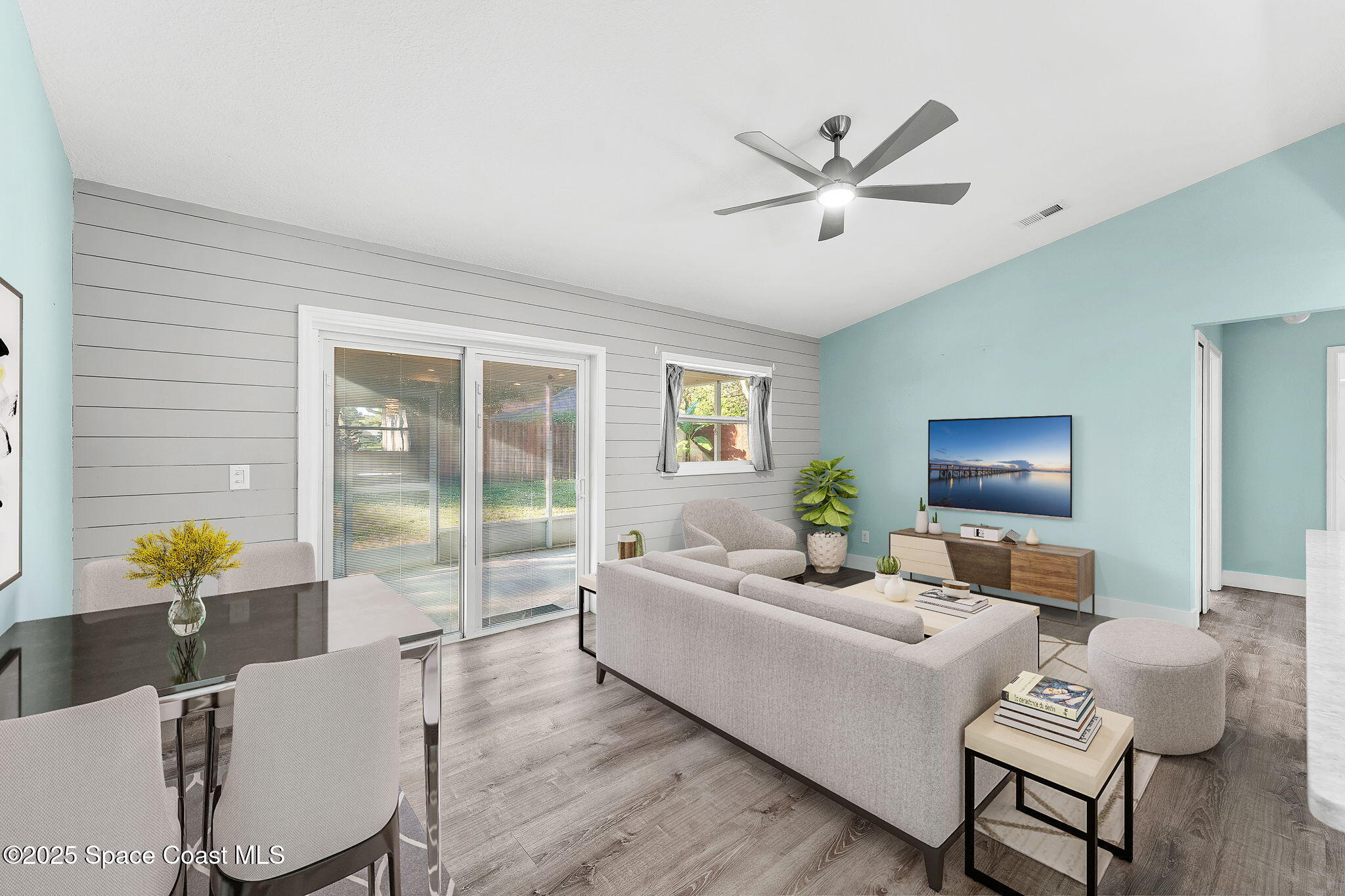 955 Sabal Grove Drive Rockledge, FL 32955 - Photo 3 of 39 a living room with furniture and wooden floor