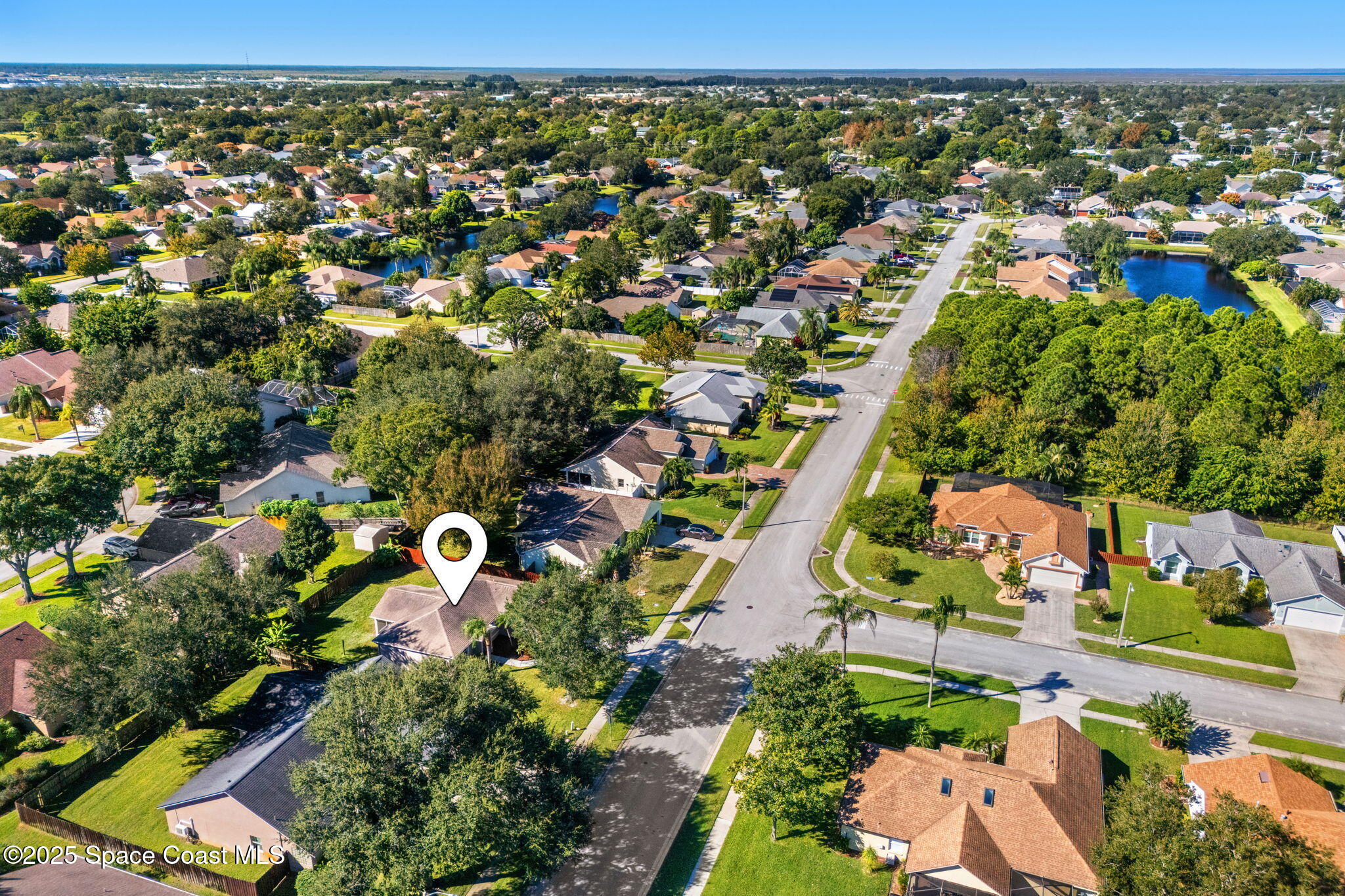 955 Sabal Grove Drive Rockledge, FL 32955 - Photo 36 of 39 an aerial view of residential houses with outdoor space and trees