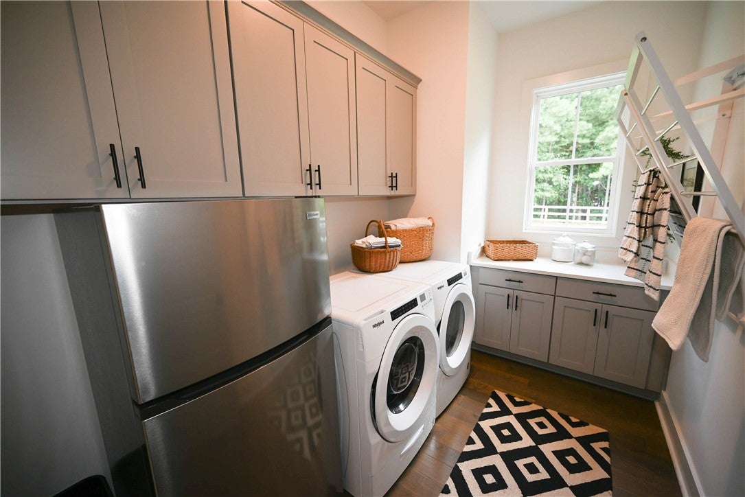 2865 Pear Tree Road Auburn, AL 36879 - Photo 20 of 49 Laundry with tons of cabinetry, drying racks, folding space, & room for a second fridge!