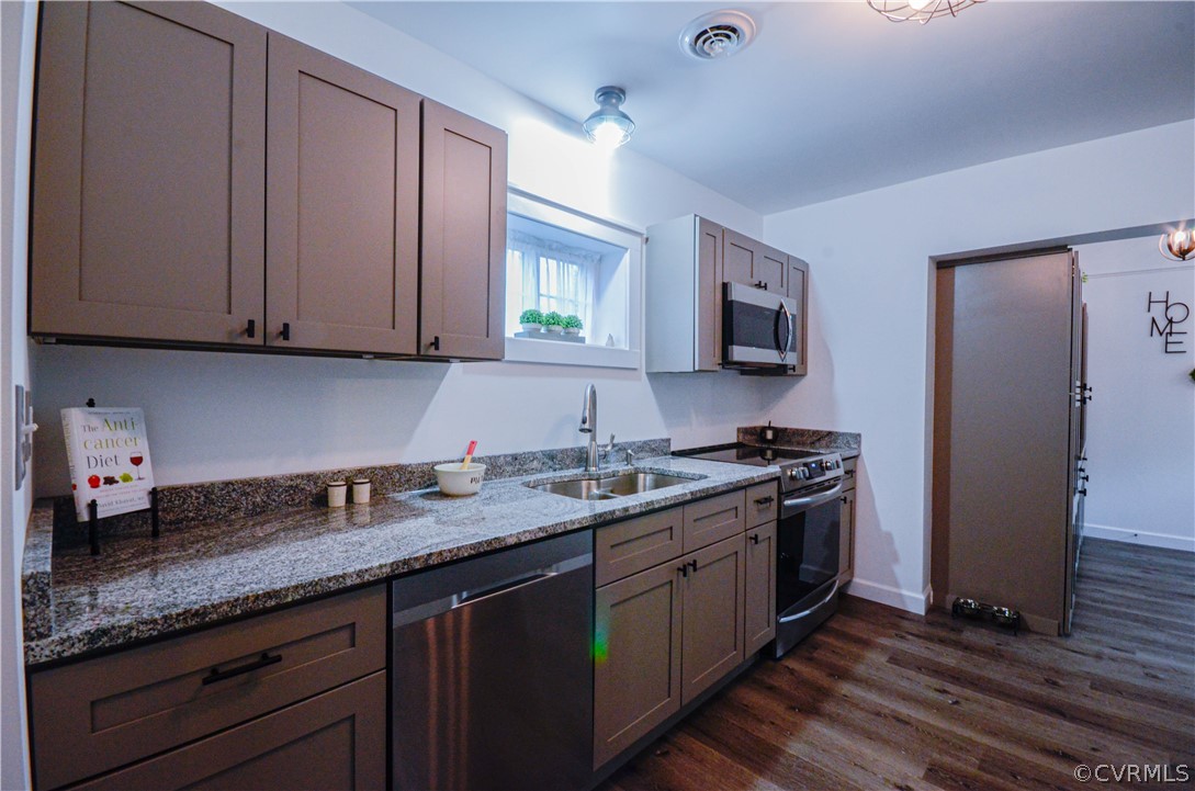 507 Old Bermuda Hundred Road Chester, VA 23836 - Photo 13 of 33 a kitchen with stainless steel appliances granite countertop a sink stove and refrigerator