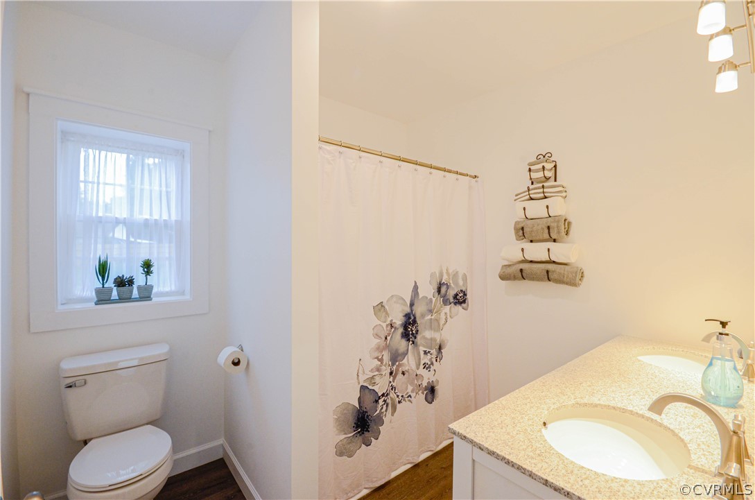 507 Old Bermuda Hundred Road Chester, VA 23836 - Photo 20 of 33 a bathroom with a granite countertop sink and a mirror