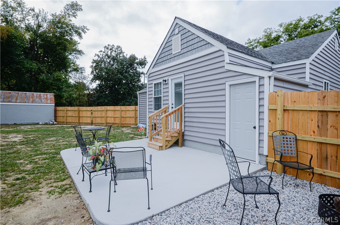 507 Old Bermuda Hundred Road Chester, VA 23836 - Photo 25 of 33 a view of a chairs and table in the back yard of the house