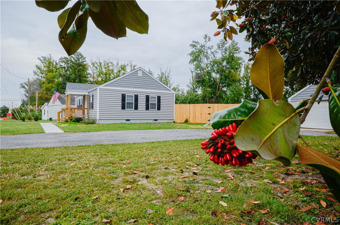 507 Old Bermuda Hundred Road Chester, VA 23836 - Photo 4 of 33 a view of a house with a small yard and a large tree