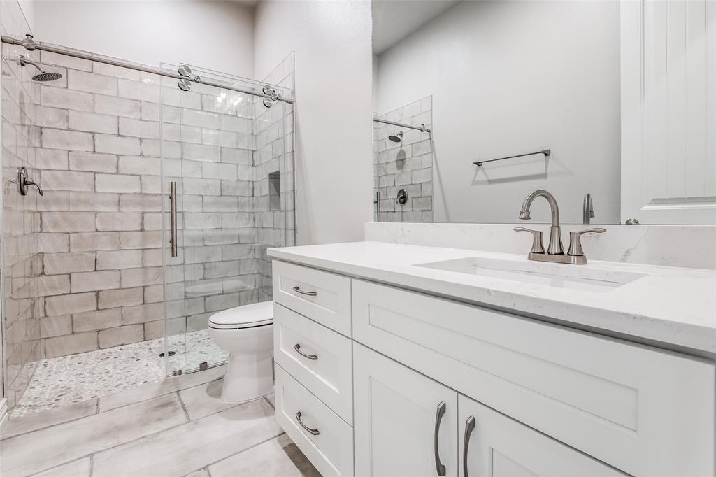 13929 Jackson Road Ponder, TX 76259 - Photo 12 of 16 a bathroom with a sink toilet and shower
