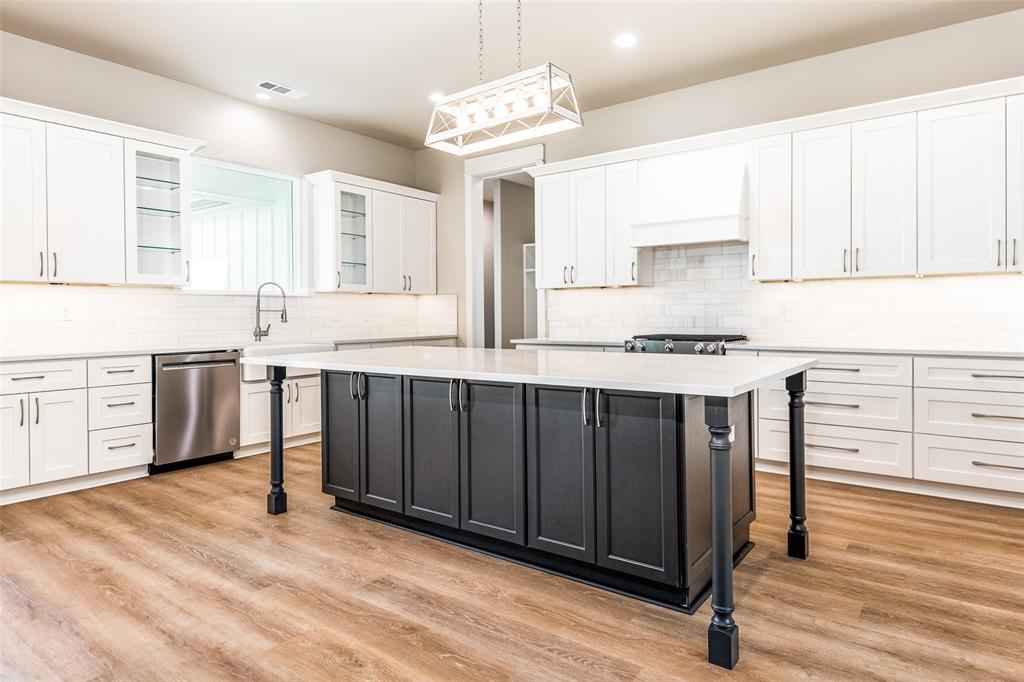 13929 Jackson Road Ponder, TX 76259 - Photo 3 of 16 a kitchen with stainless steel appliances granite countertop a stove sink and cabinets