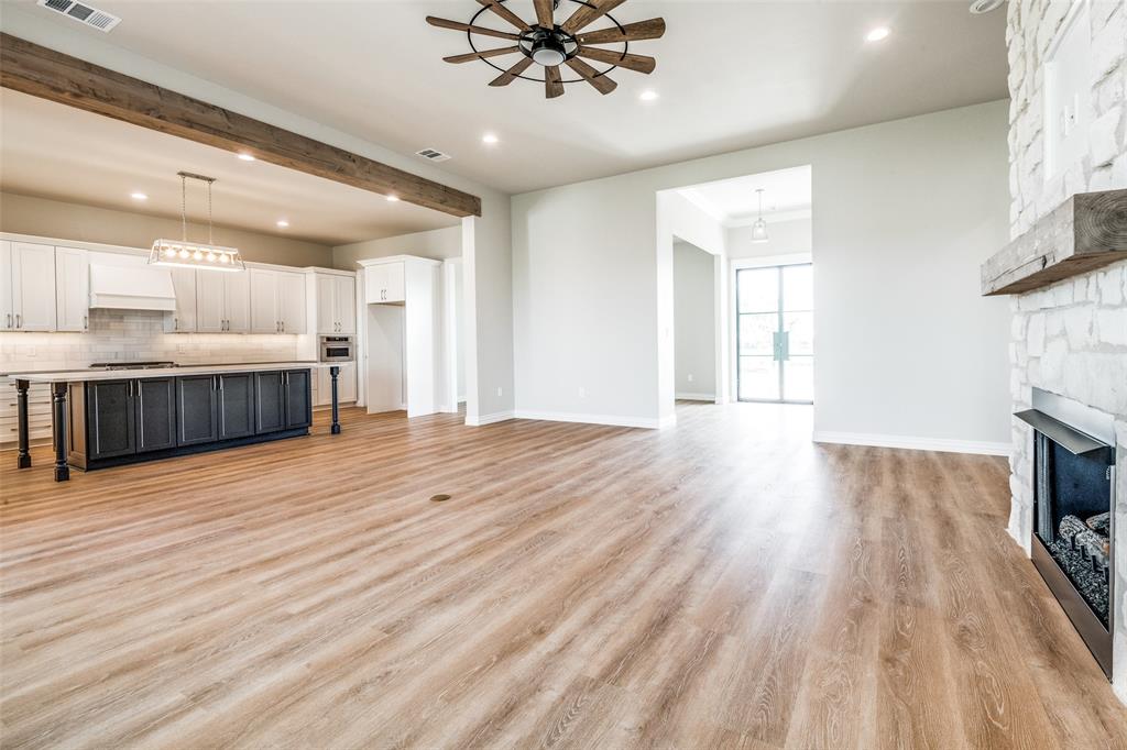 13929 Jackson Road Ponder, TX 76259 - Photo 6 of 16 a view of a kitchen with a sink and a fireplace