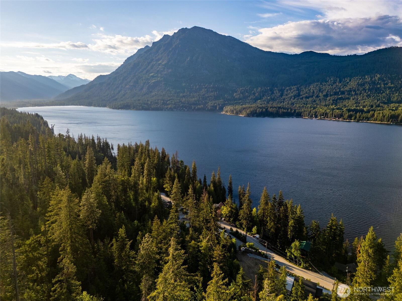 16063 Cedar Brae Road Leavenworth, WA 98826 - Photo 1 of 19 a view of a lake with a mountain in the background