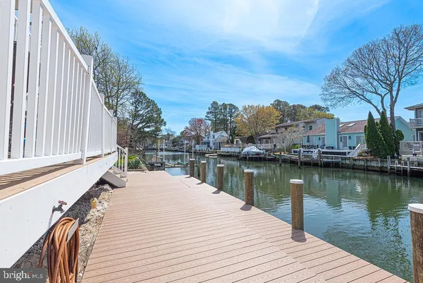 a view of balcony with wooden floor and lake view