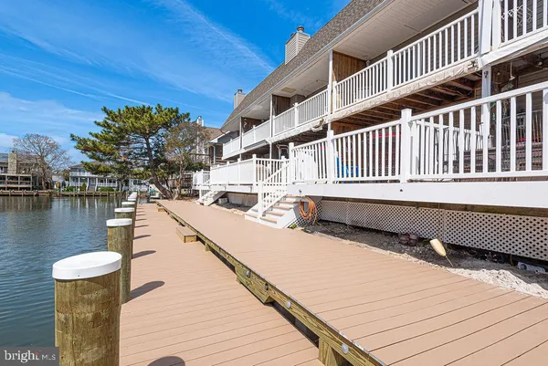 a living room with furniture fireplace and flat screen tv
