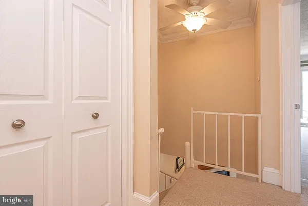 a bedroom with furniture and a large window