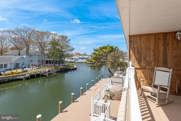 a en suite bathroom with a granite countertop sink mirror and vanity