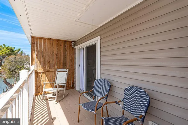 a bedroom with a bed and a television