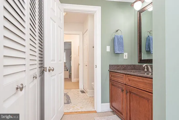a bedroom with a bed and a flat tv screen in it