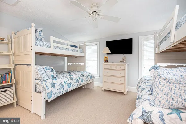 an aerial view of a house with a ocean view