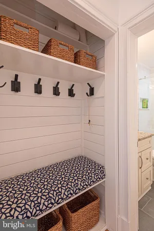 a bathroom with a granite countertop sink a toilet and shower