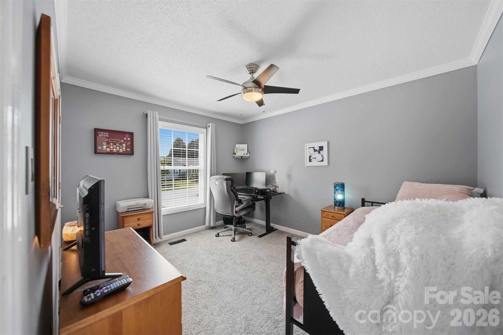 2104 Sheffield Court Northwest Conover, NC 28613 - Photo 16 of 25 a bedroom with furniture and a desk