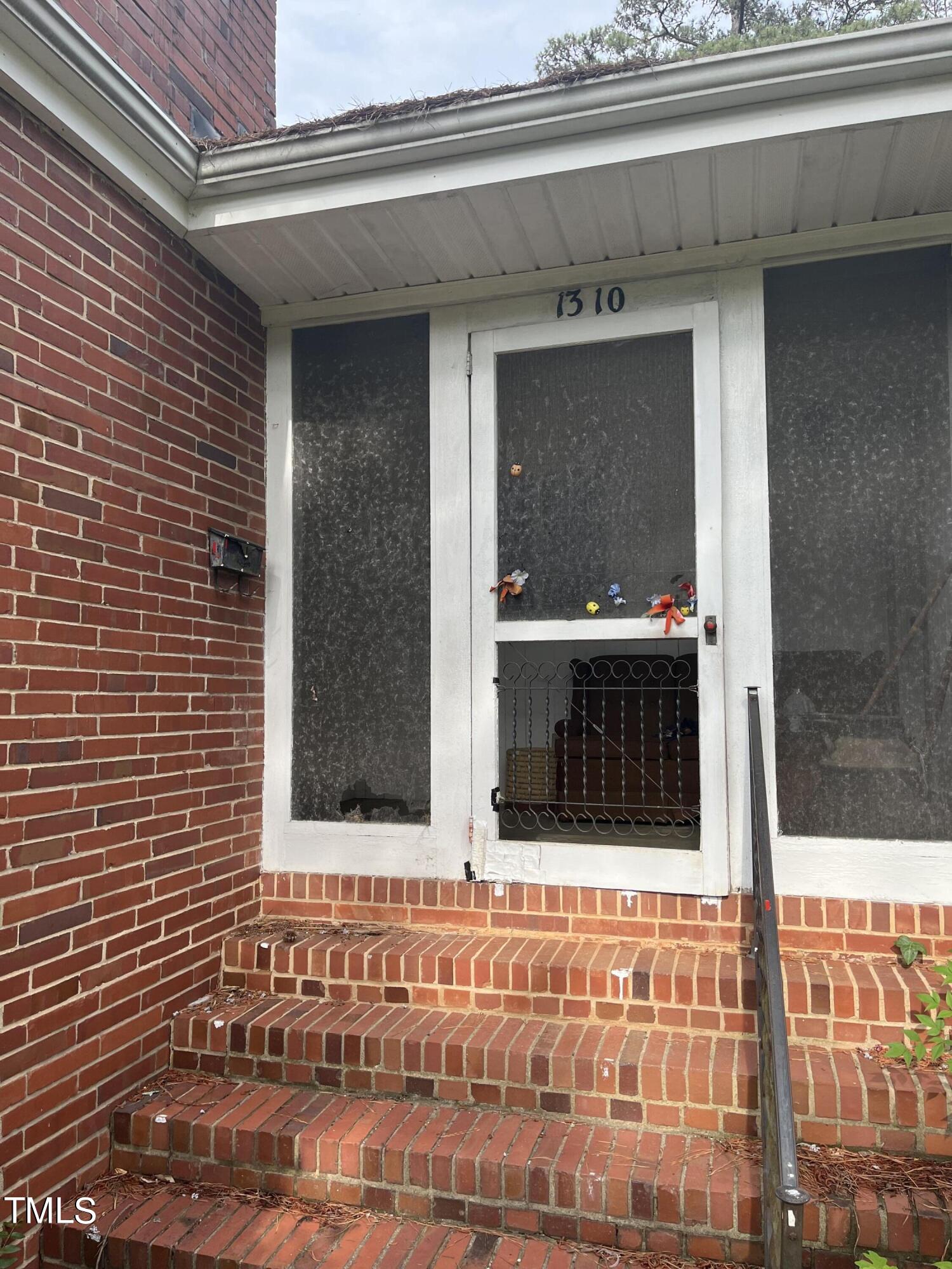 1310 Mayfair Road Raleigh, NC 27608 - Photo 2 of 3 a view of entryway with a front door
