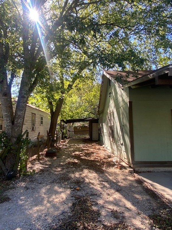 523 South Rio Grande Street Lockhart, TX 78644 - Photo 4 of 16 View of side of property with driveway