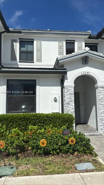 13241 Southwest 285th Street Homestead, FL 33033 - Photo 14 of 14 a front view of a house with garden