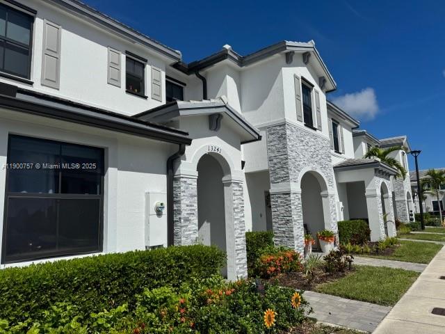 13241 Southwest 285th Street Homestead, FL 33033 - Photo 2 of 14 a front view of a house with garden