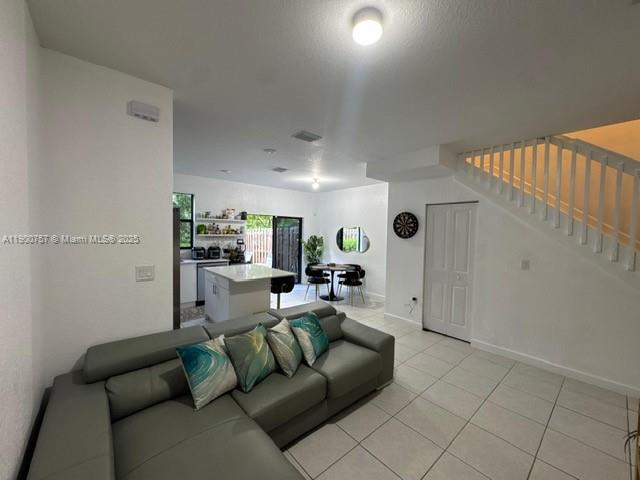 13241 Southwest 285th Street Homestead, FL 33033 - Photo 6 of 14 a view of a livingroom with furniture and a fireplace