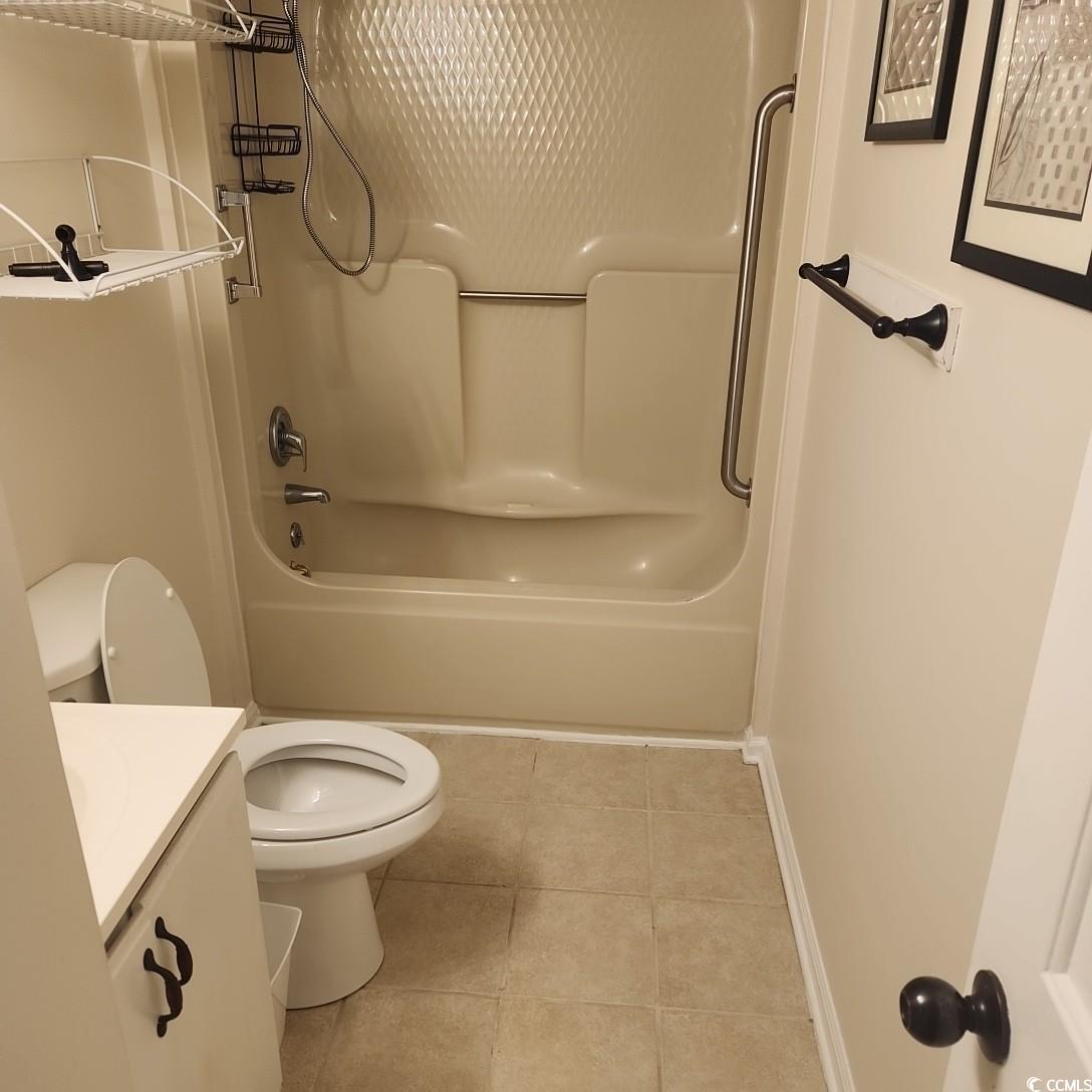 1300 Deer Creek Road, Unit C Surfside Beach, SC 29575 - Photo 17 of 18 Bathroom with vanity, tile patterned flooring, and bathtub / shower combination