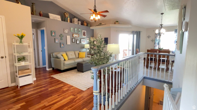 1797 Sunset Road Enoch, UT 84721 - Photo 35 of 80 Open-concept living space with wood-finish flooring, a vaulted ceiling, and a ceiling fan