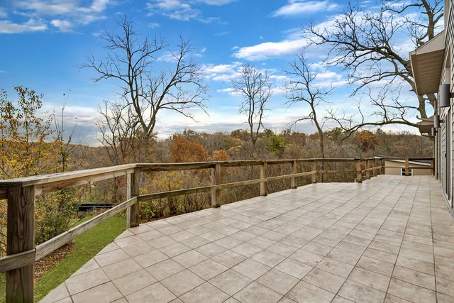 a view of balcony with wooden fence