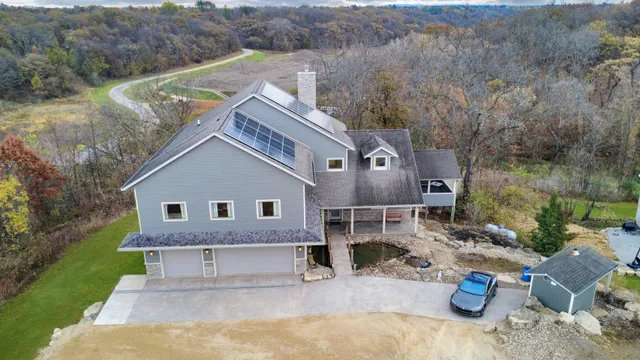 a view of backyard with outdoor seating and green space