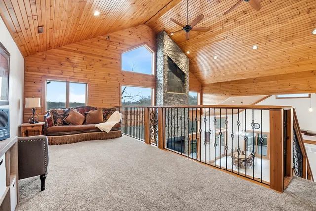 a balcony with furniture and a potted plant