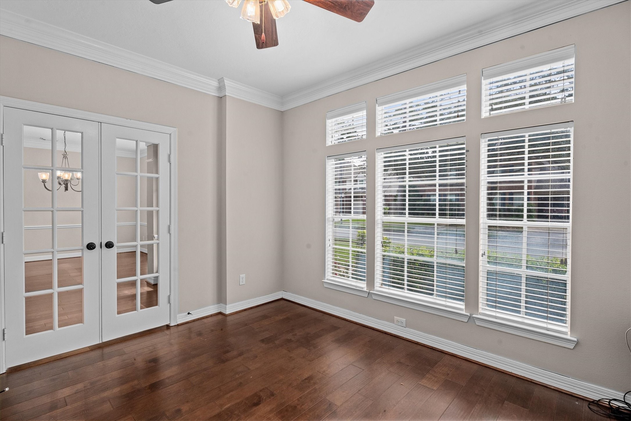 14914 Codys Run Cypress, TX 77429 - Photo 15 of 44 a view of an empty room with wooden floor and windows