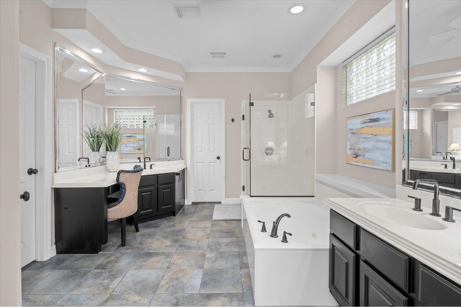 14914 Codys Run Cypress, TX 77429 - Photo 17 of 44 a bathroom with a double vanity sink a mirror and a bathtub