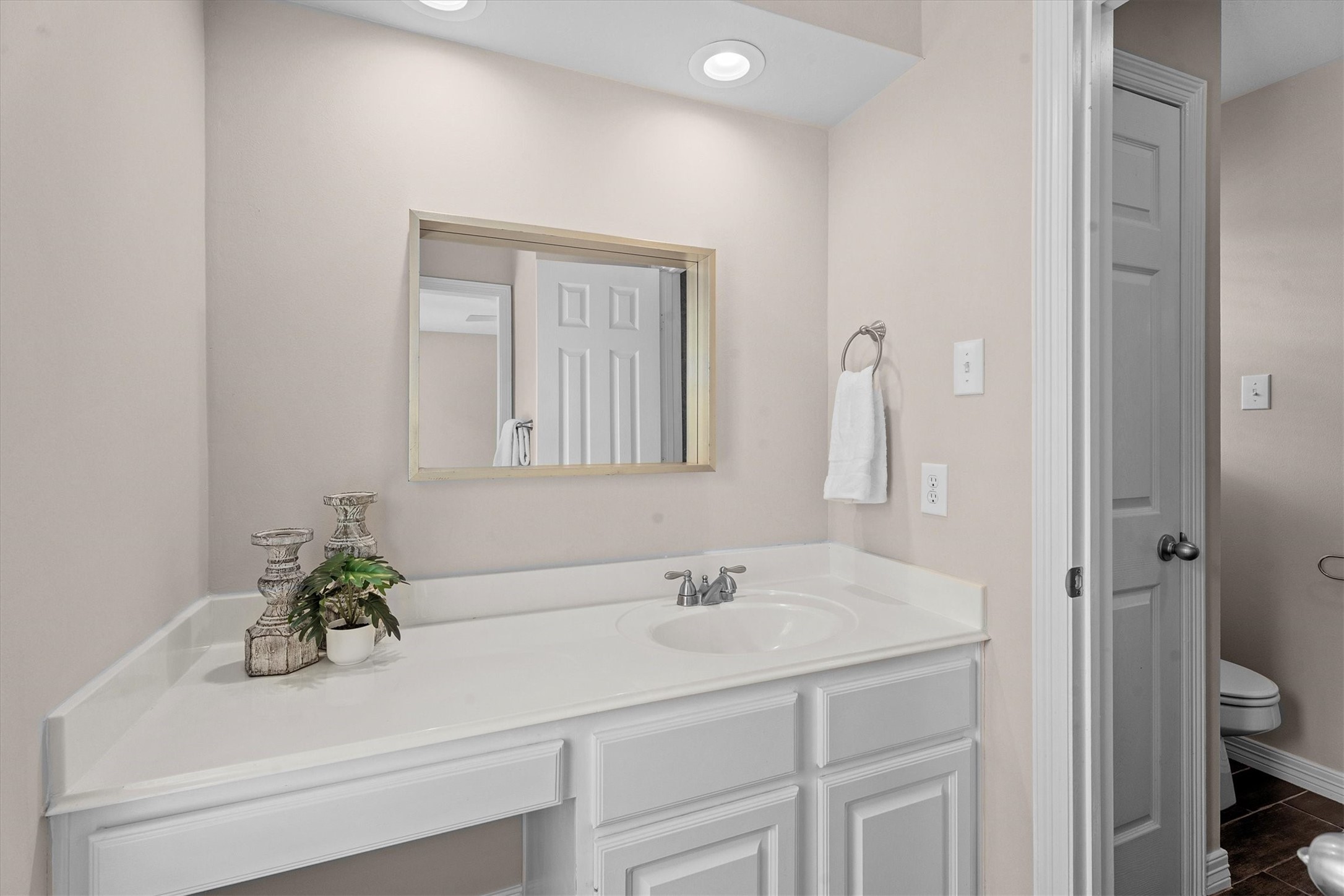 14914 Codys Run Cypress, TX 77429 - Photo 28 of 44 a bathroom with a sink a toilet and a mirror