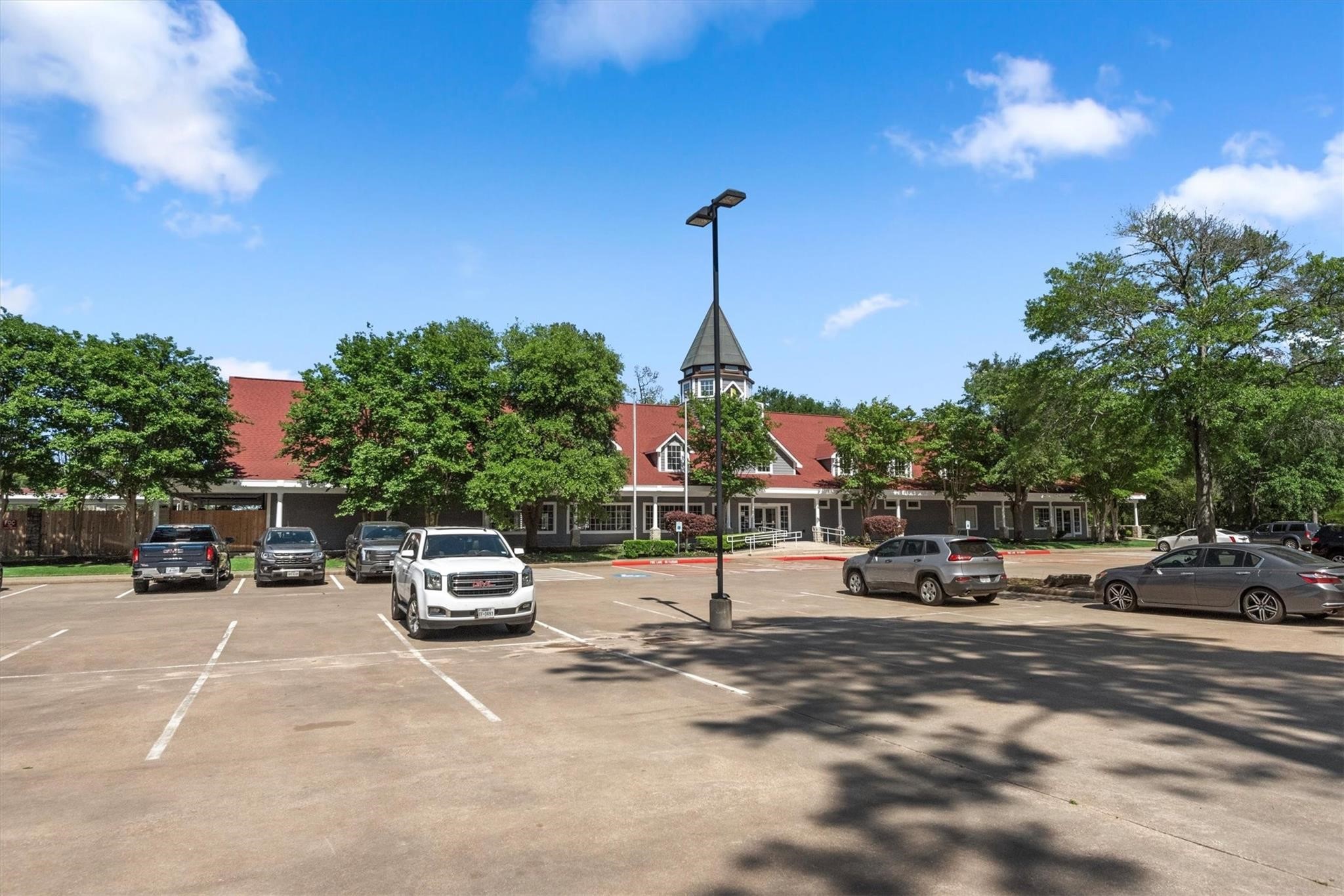 14914 Codys Run Cypress, TX 77429 - Photo 39 of 44 a cars parked in front of a building
