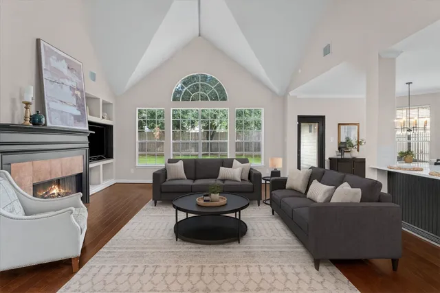 a living room with furniture and a large window