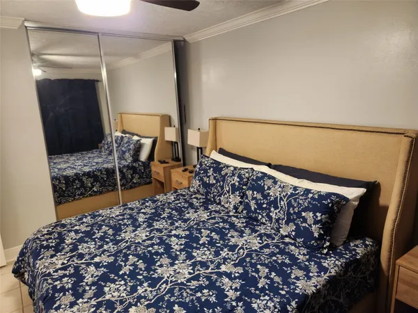 a bathroom with a granite countertop sink a toilet and a mirror