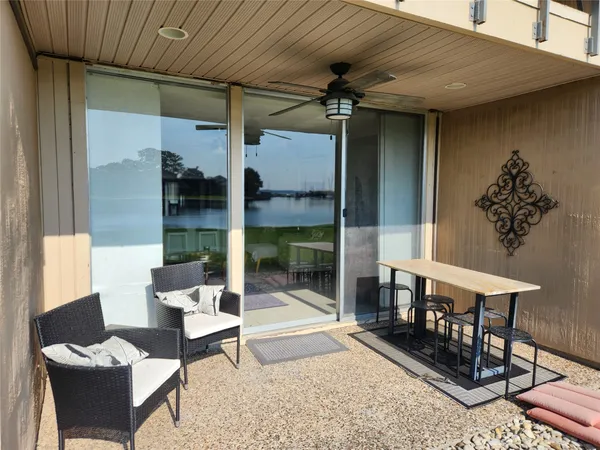 a view of a backyard with plants and lake view