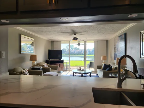 a living room with furniture window and a flat screen tv