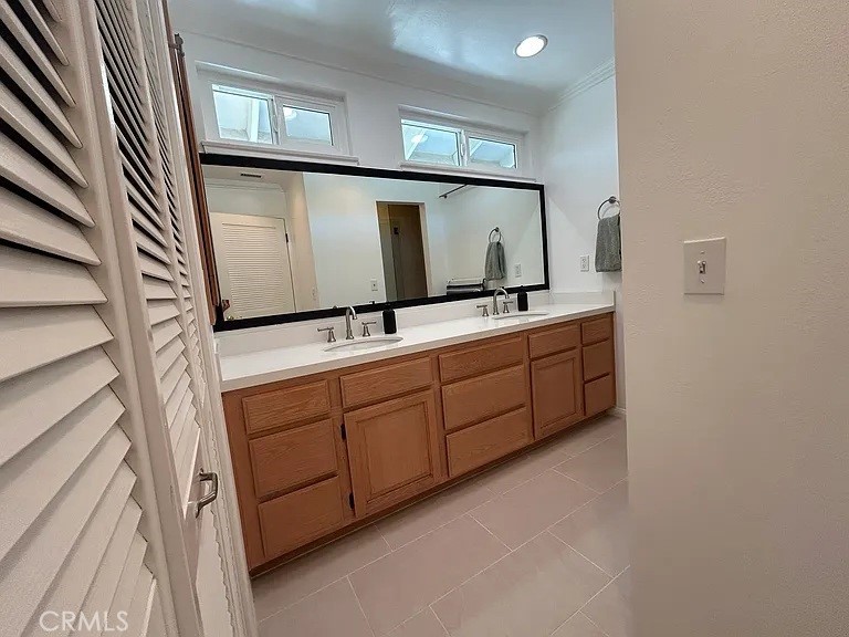 3816 Hartung Court Newbury Park, CA 91320 - Photo 12 of 19 a bathroom with a double vanity sink and mirror