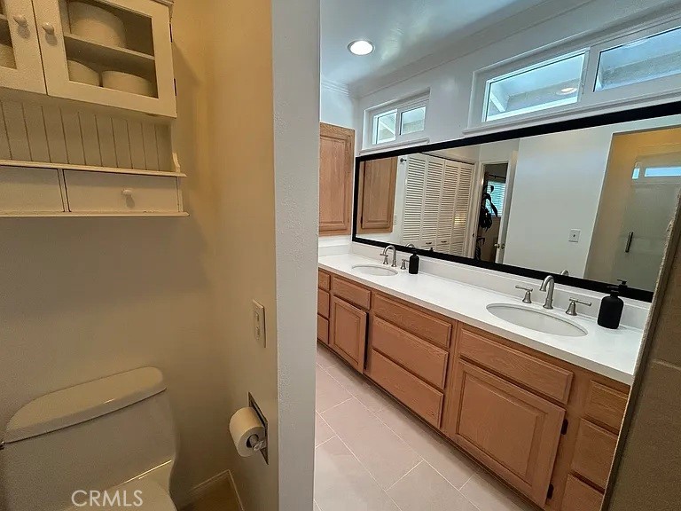 3816 Hartung Court Newbury Park, CA 91320 - Photo 13 of 19 a bathroom with a double vanity sink and mirror