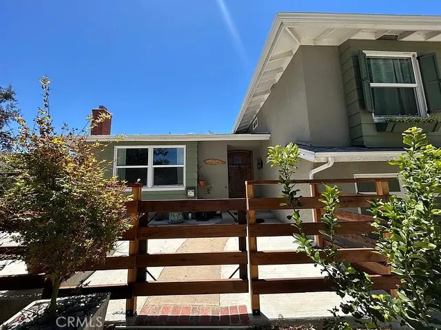 a front view of a house with parking
