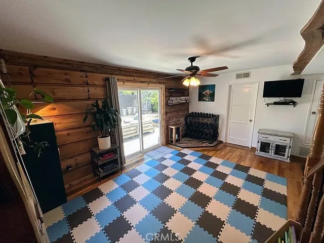 a bedroom with furniture and a flat screen tv